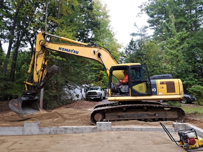 Woman Operating a Front Loader