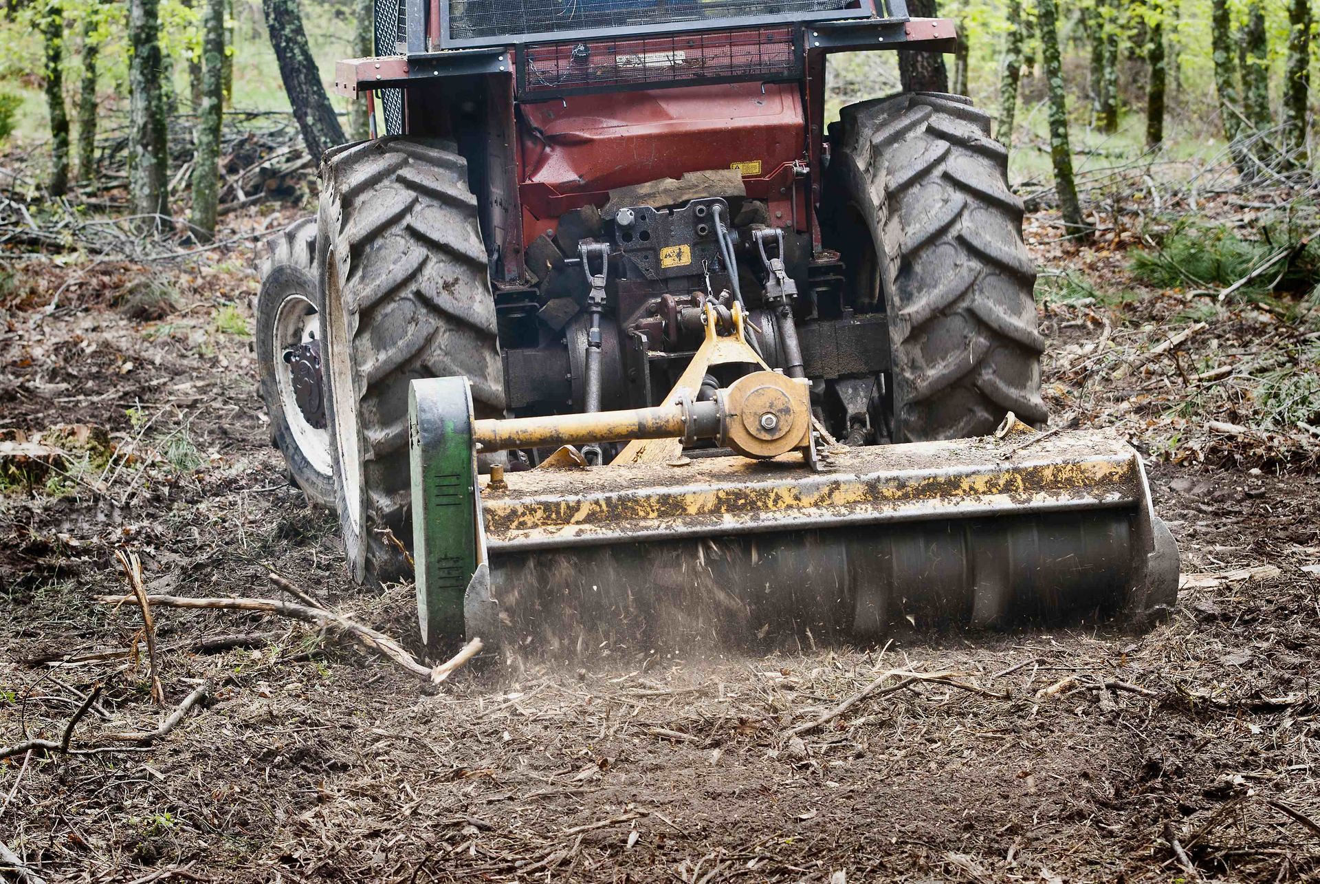 a red tractor on work