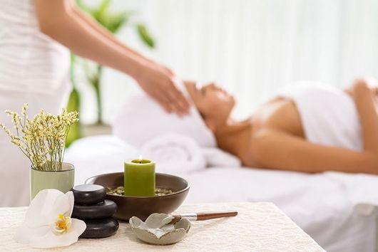 A Woman is Getting a Massage at a Spa — Naked Skin Day Spa & Cocktail Lounge in Mooloolaba, QLD