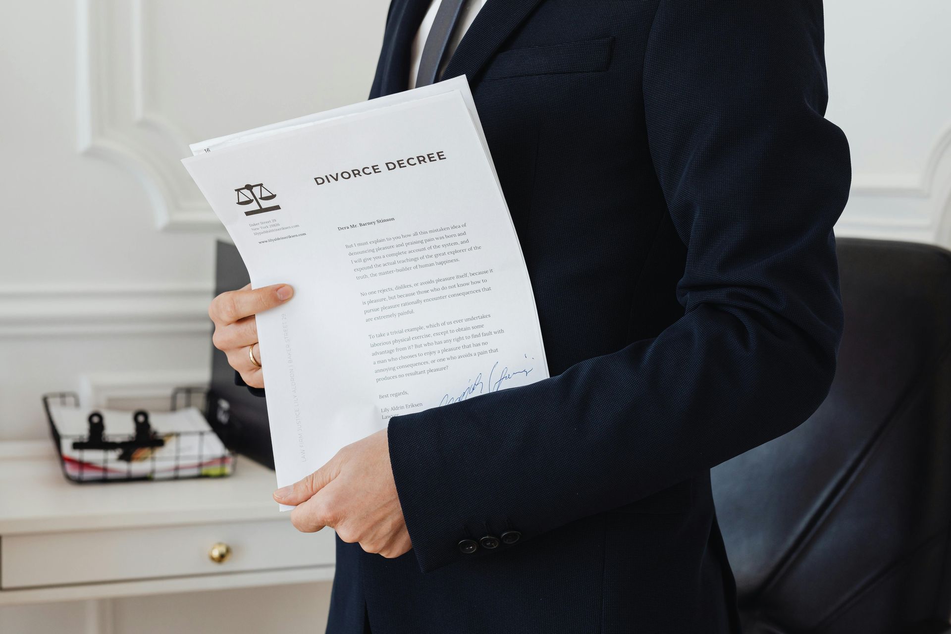 Person in a suit holding a 