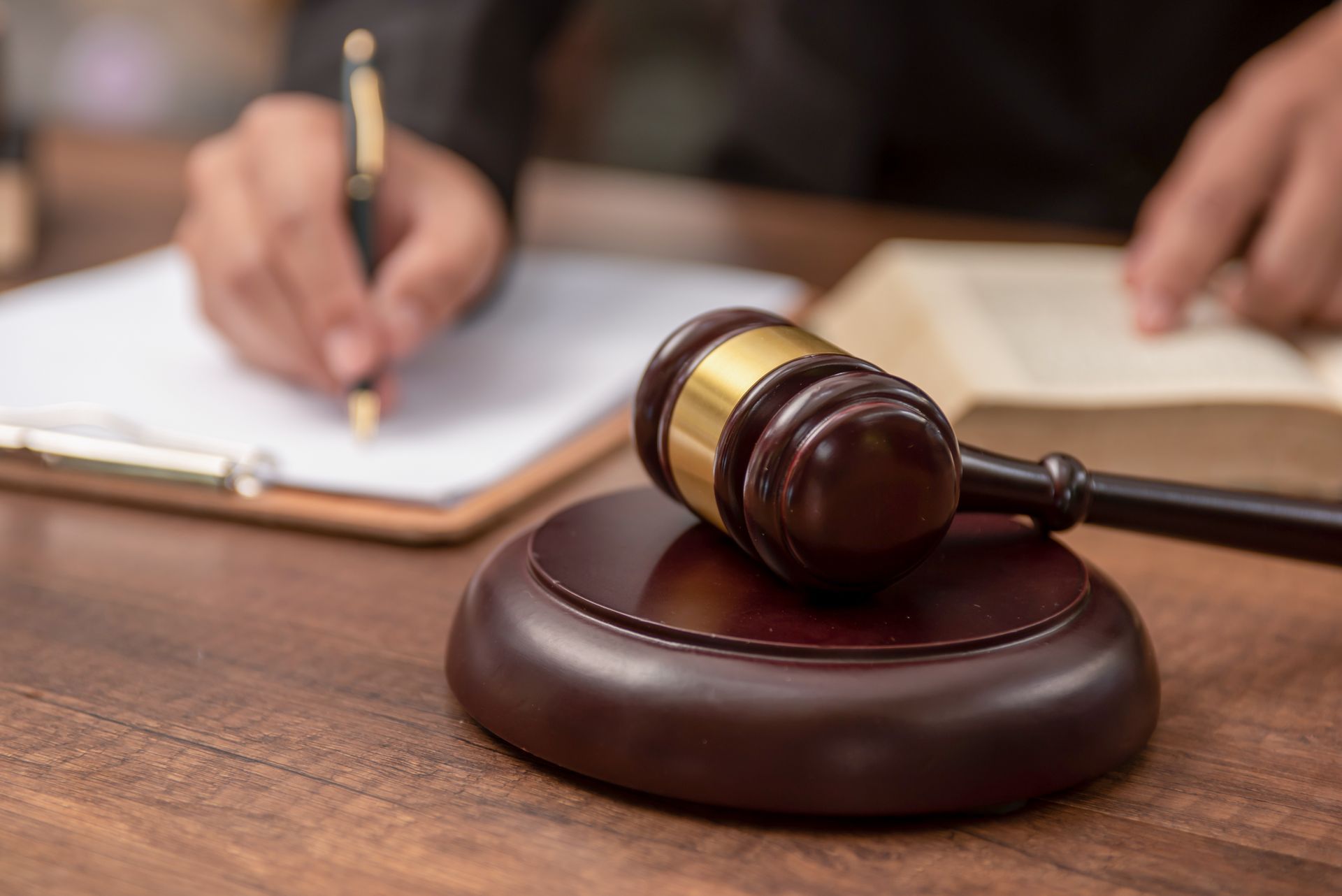 A judge 's gavel and paperwork being filled out