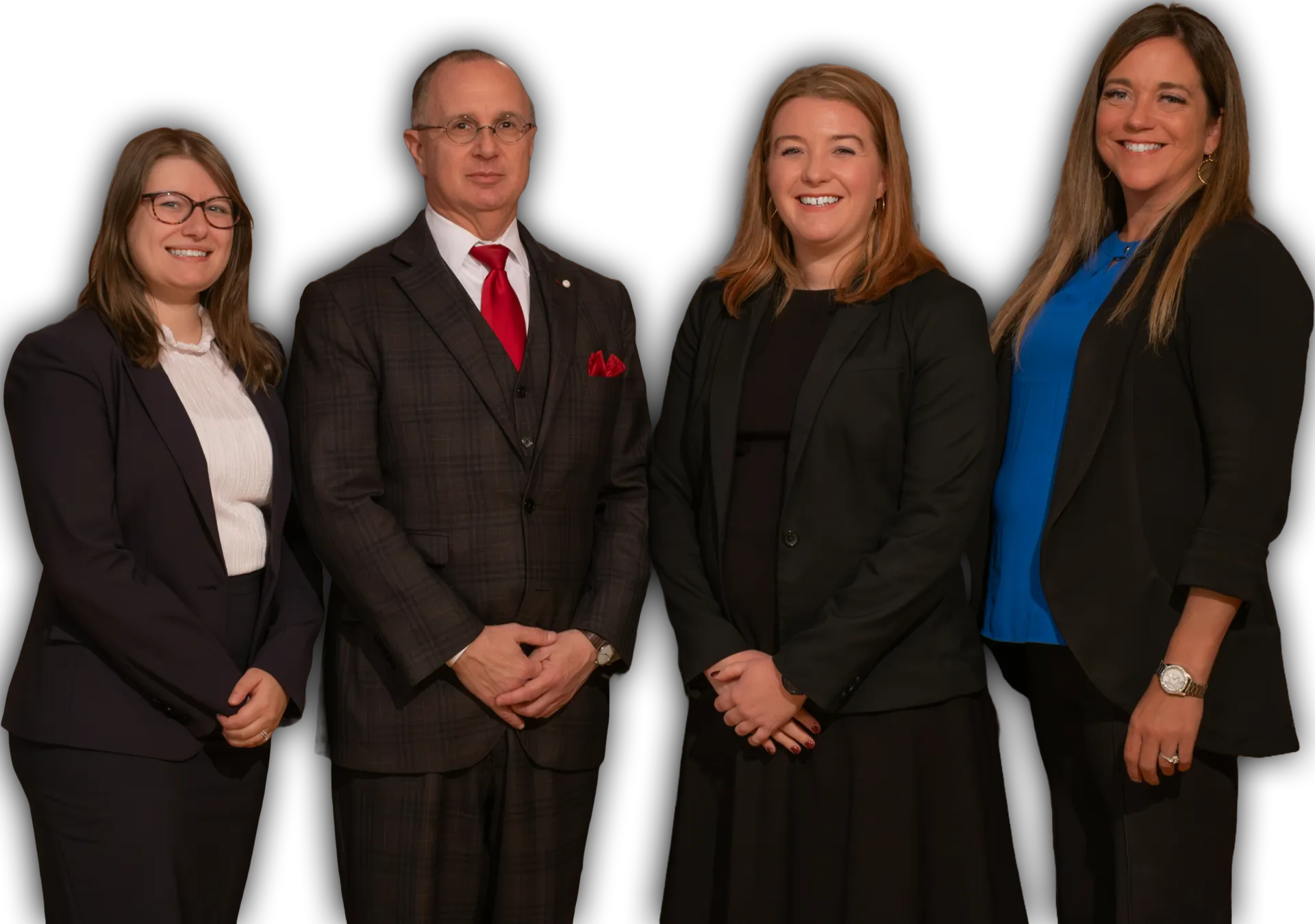 A group of people in suits and ties are posing for a picture