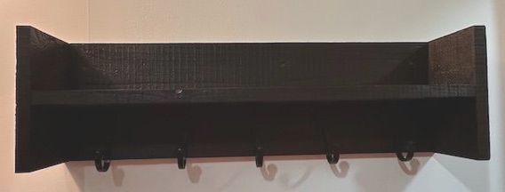 Dark brown wooden wall shelf with hooks.