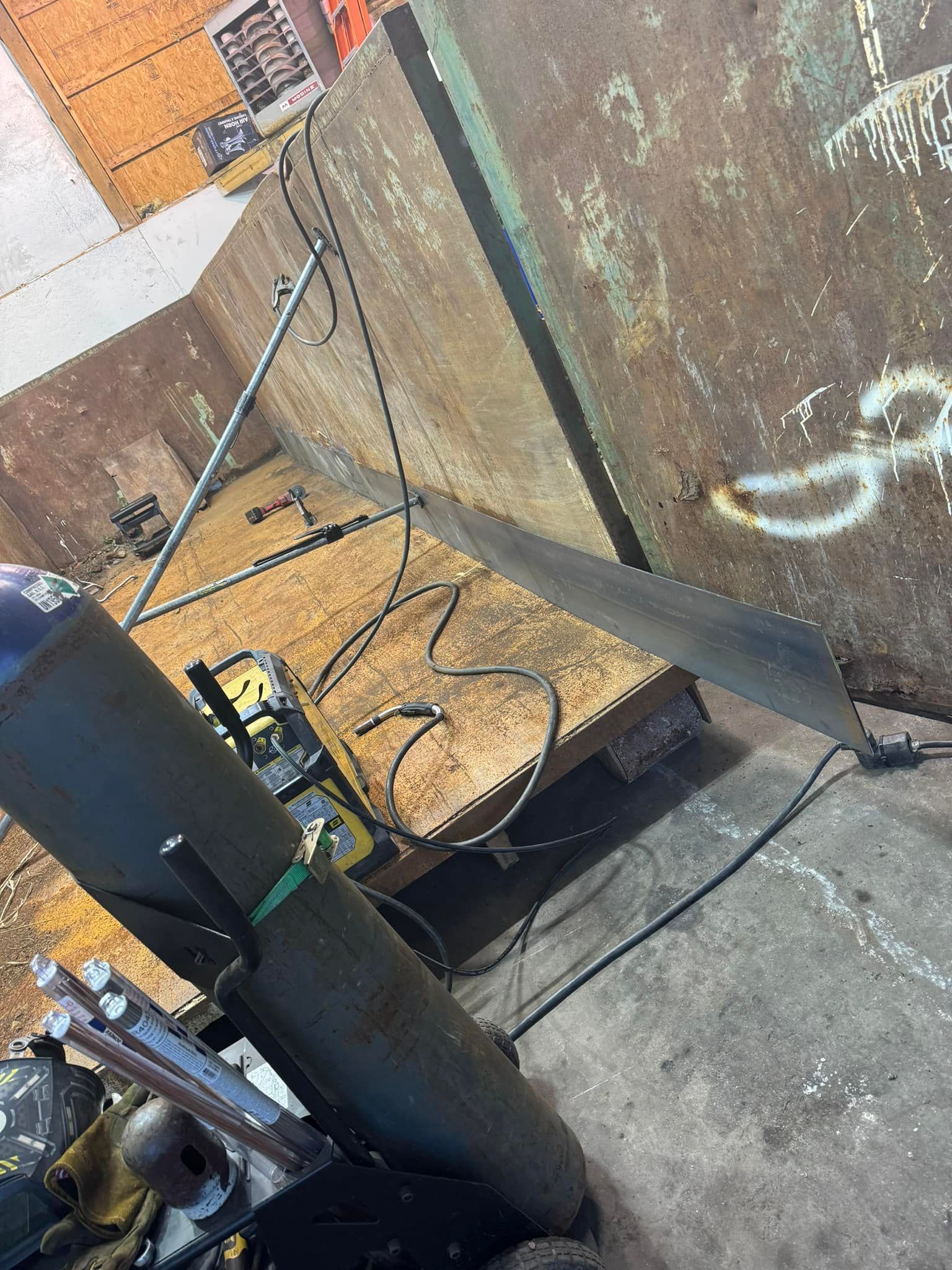 Welding equipment set up in an industrial setting.