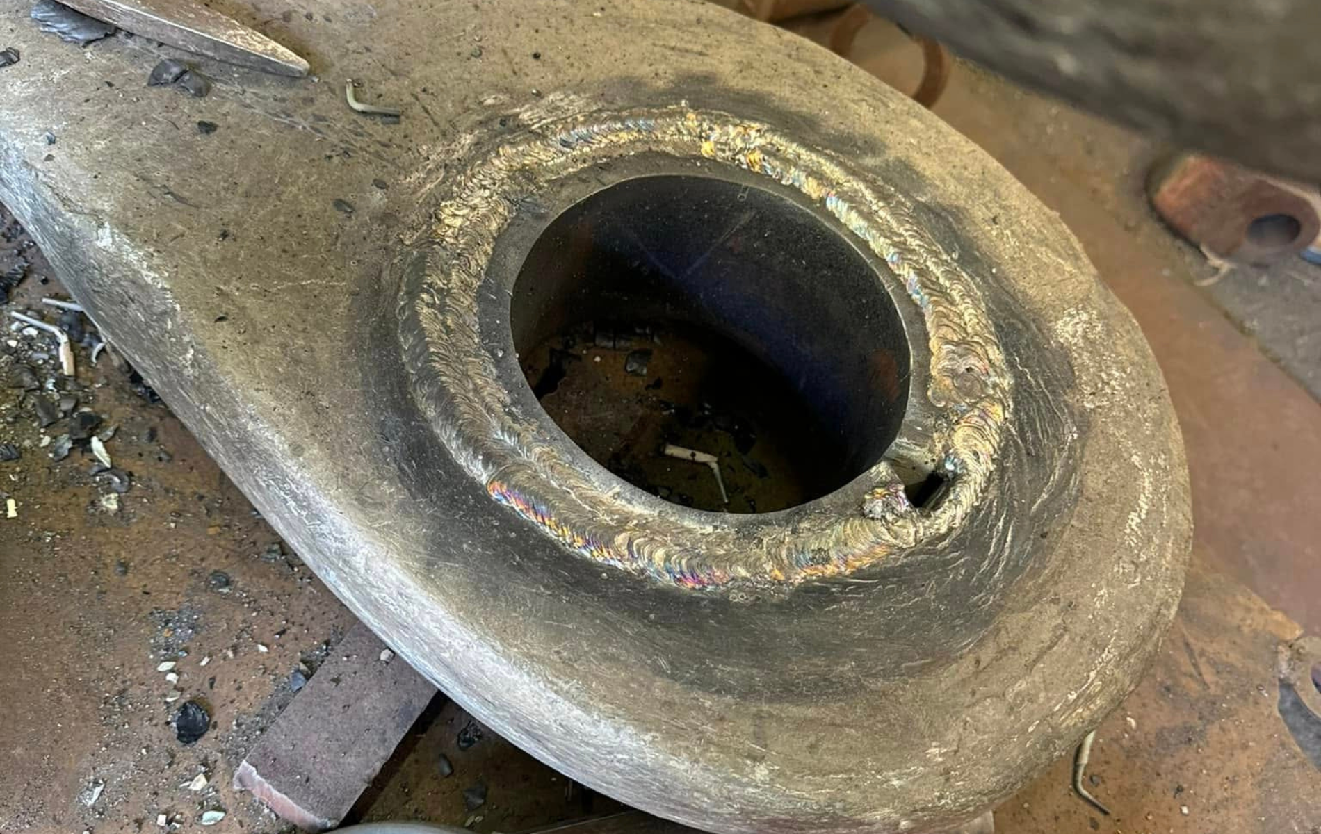 A close up of a metal object with a hole in it.