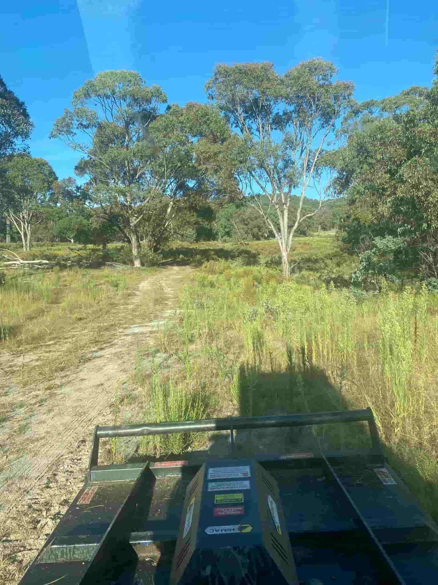 A Dirt Road in the Middle of a Grassy Field — St Elmo Contracting in Peelwood, NSW