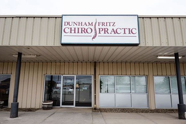 A building with a sign that says dunham fritz chiropractic