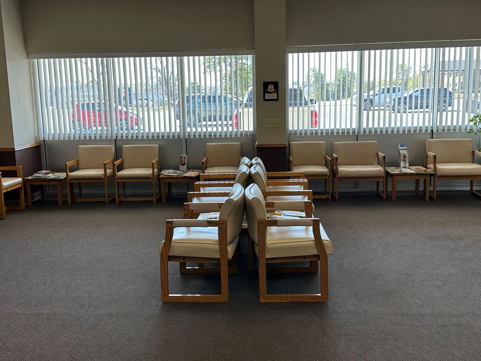 A waiting room with a lot of chairs and tables