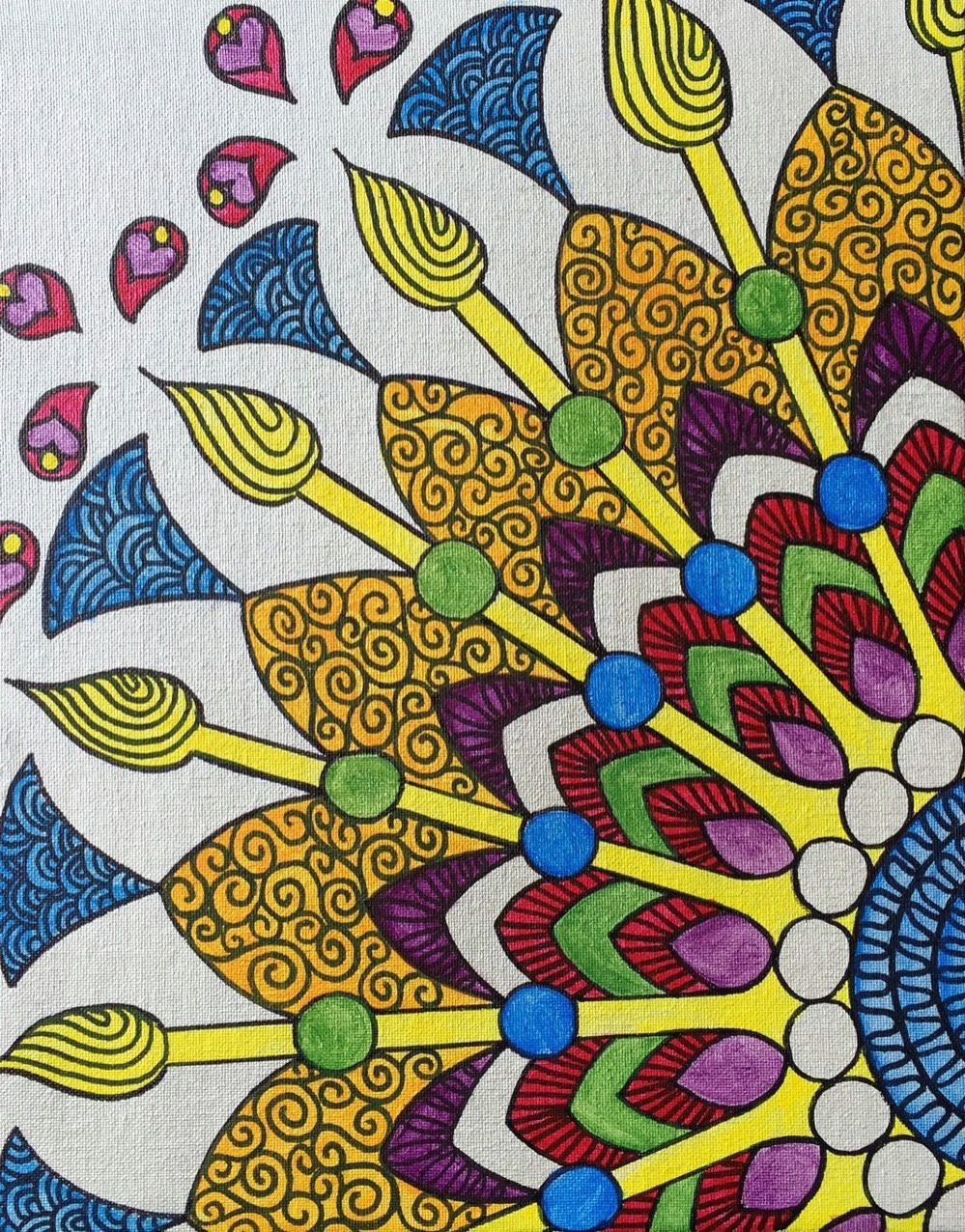 A colorful drawing of a circle with leaves and swirls