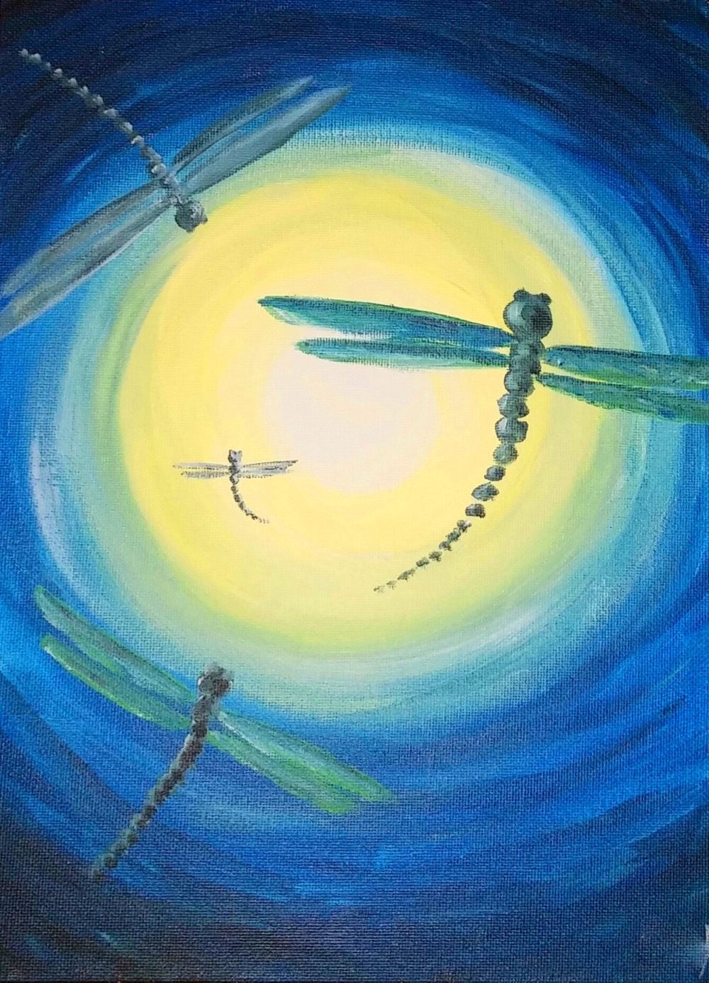 A painting of three dragonflies flying in front of a full moon.
