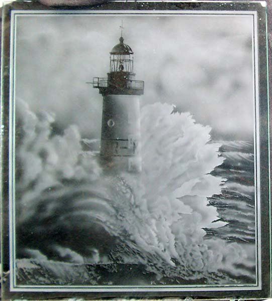 closeup of lighthouse framed using glass
