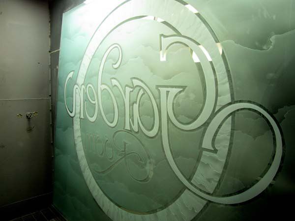 store logo on front door, written in stained glass