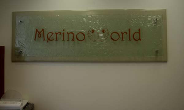 merino world glass sign
