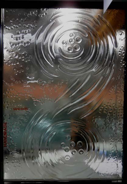 sand swirl design in textured glass