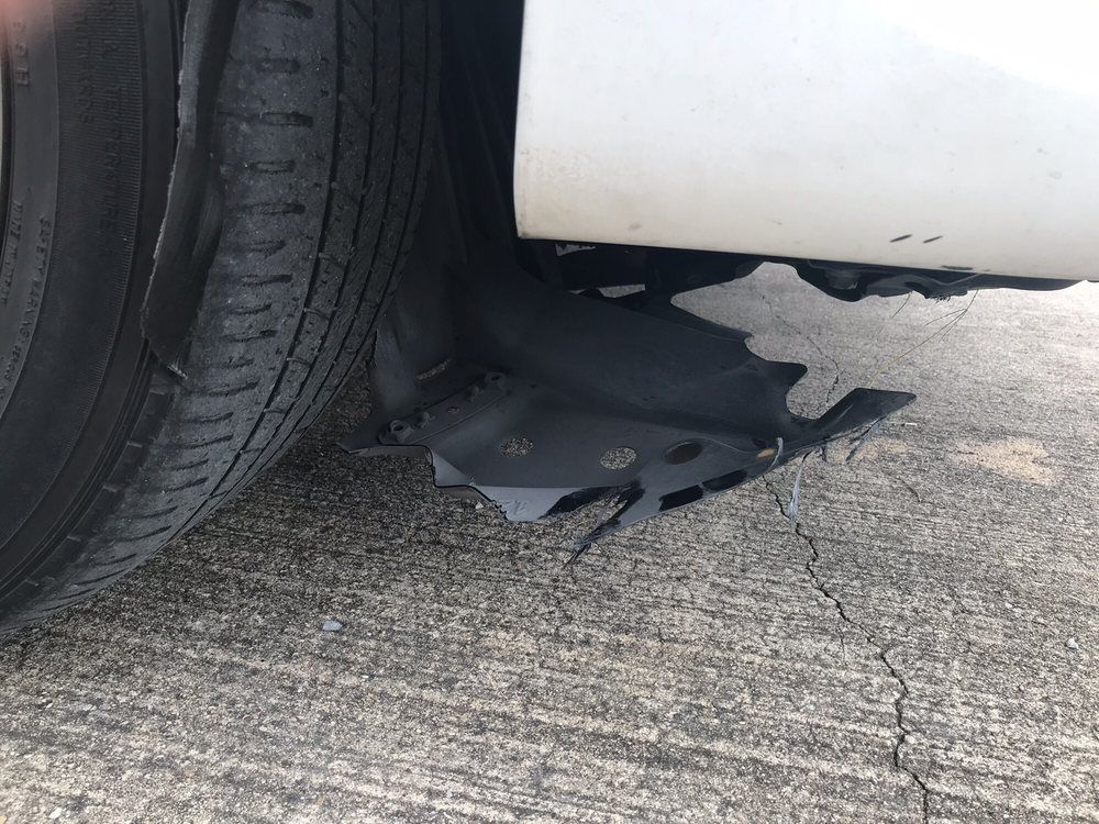 A close up of a car tire on a concrete surface.