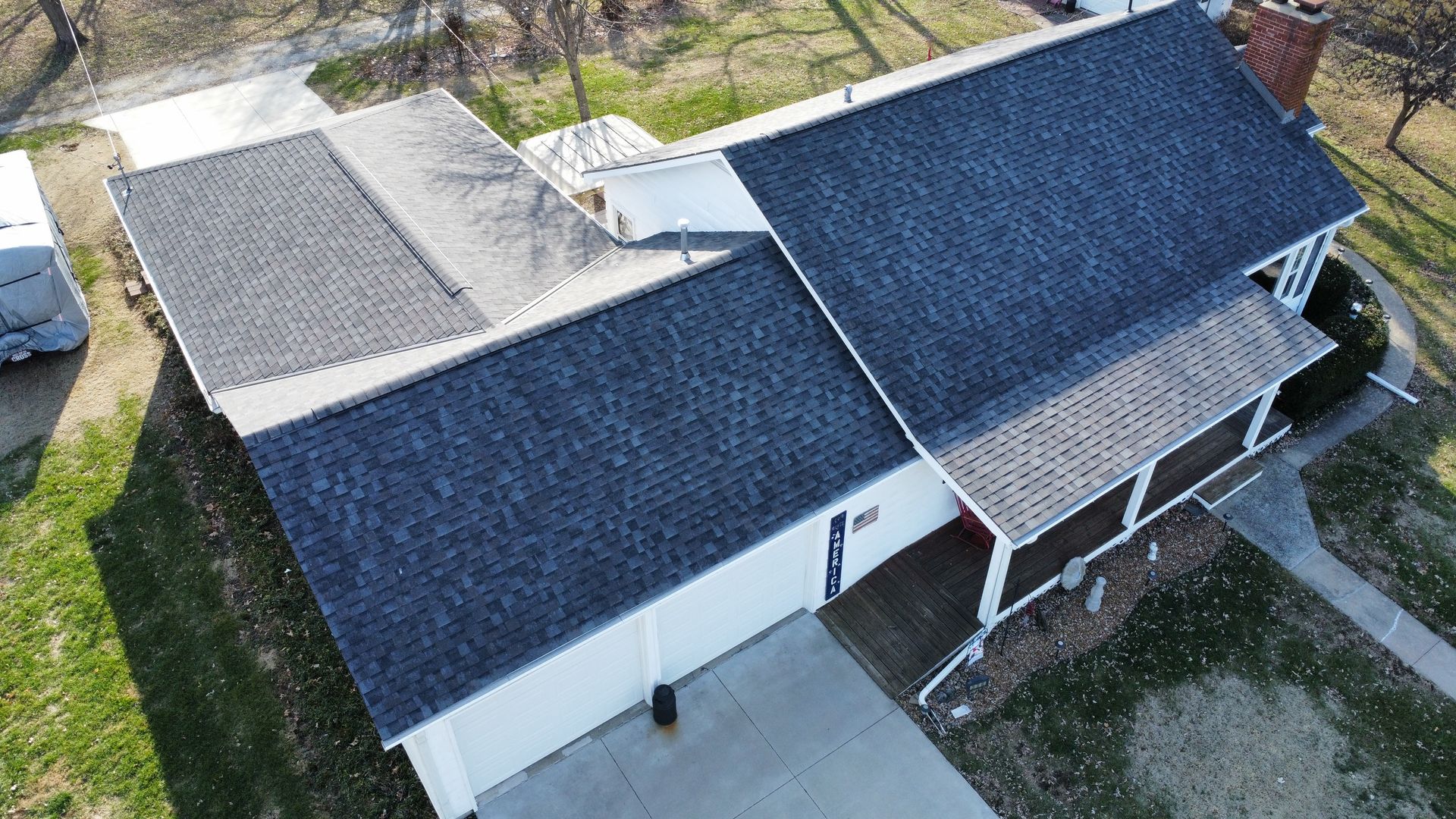 An aerial view of a house with a Williamsburg Gray Shingle.