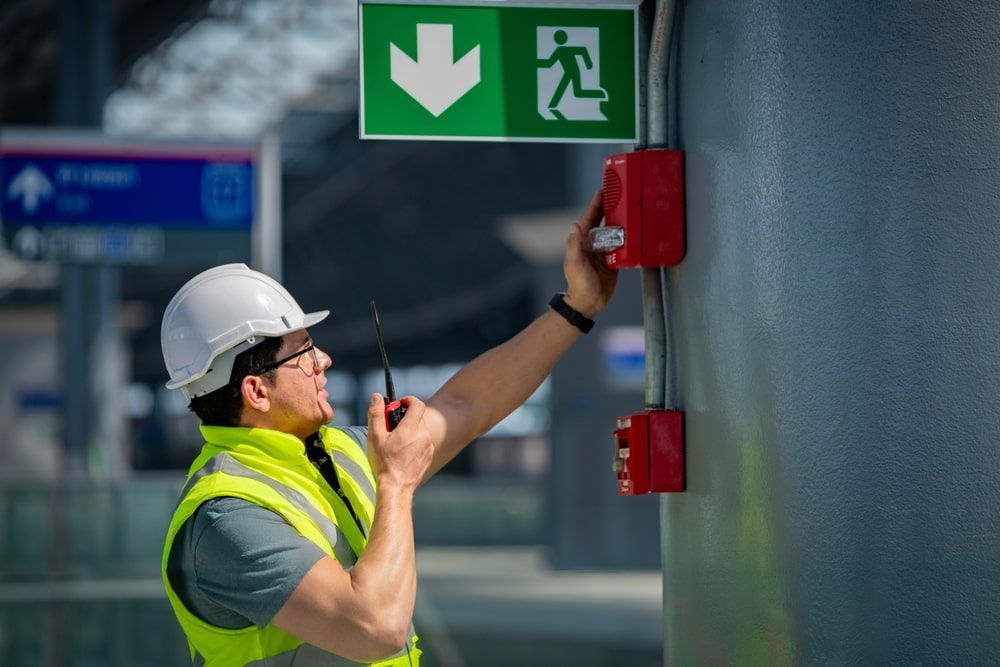 Safety engineer checking fire alarm system