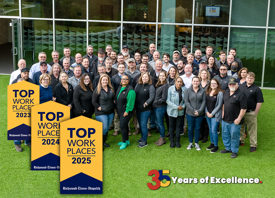 Group of people in front of a building, holding