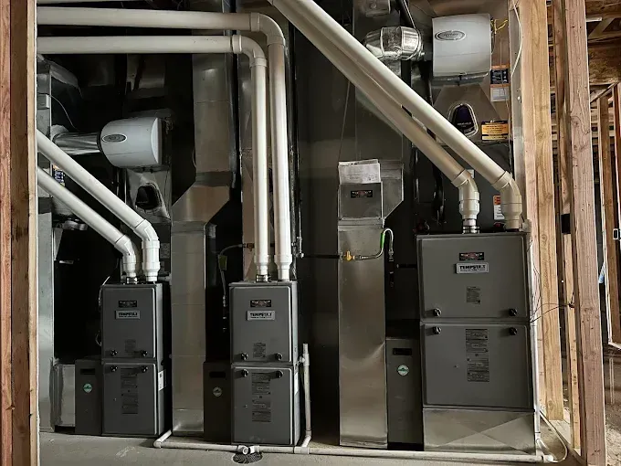 A room with a lot of pipes and appliances in it