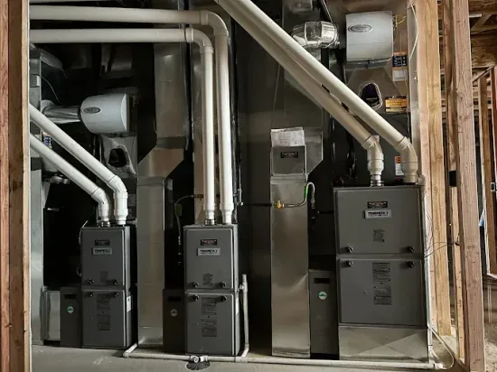 A room with a lot of pipes and appliances in it