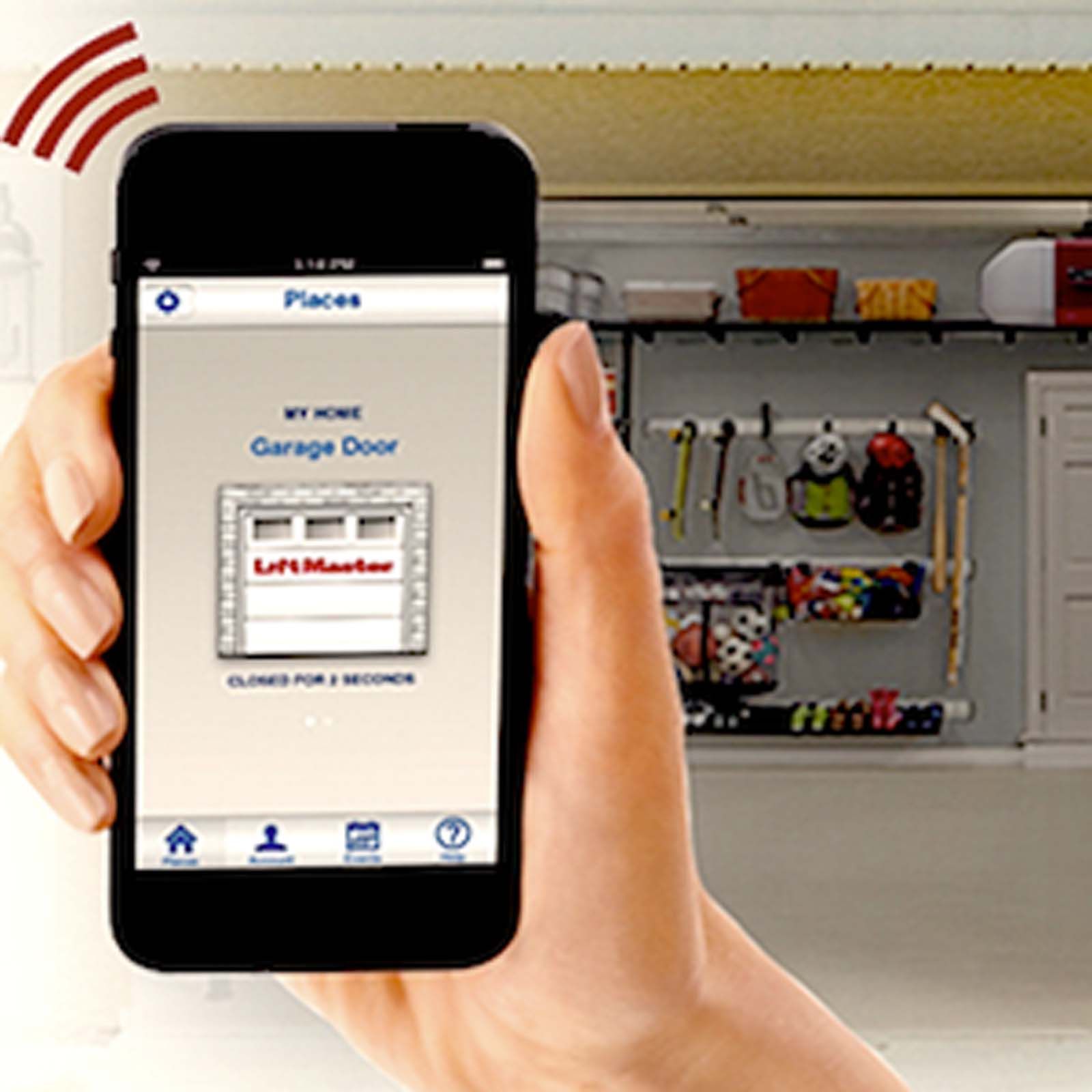 A person is holding a cell phone in front of a garage door