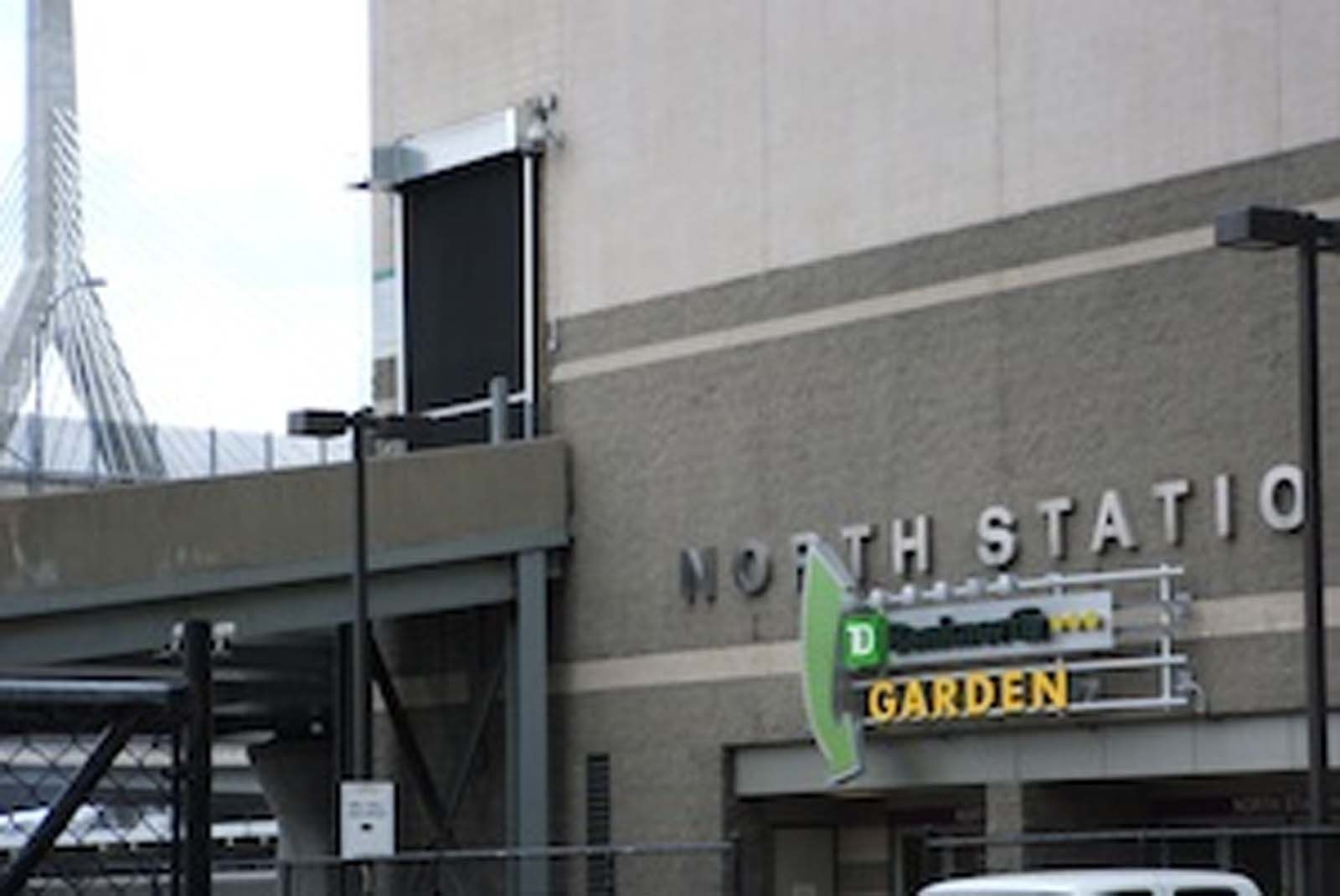 A white van is parked in front of the north station garden