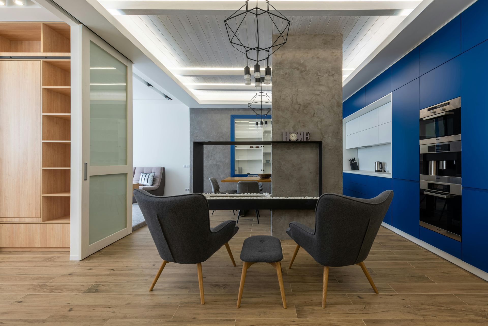 A living room with two chairs and a table.