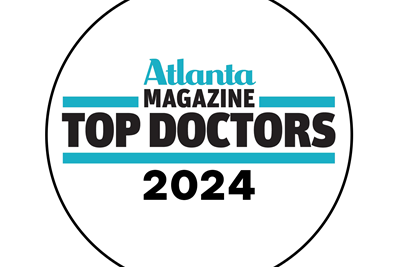 Atlanta Magazine Top Doctors 2024 seal. Text on white background with blue bars, black text, and a black circular outline.