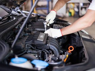Electrical System — Hands of Car Mechanic in Eugene, OR