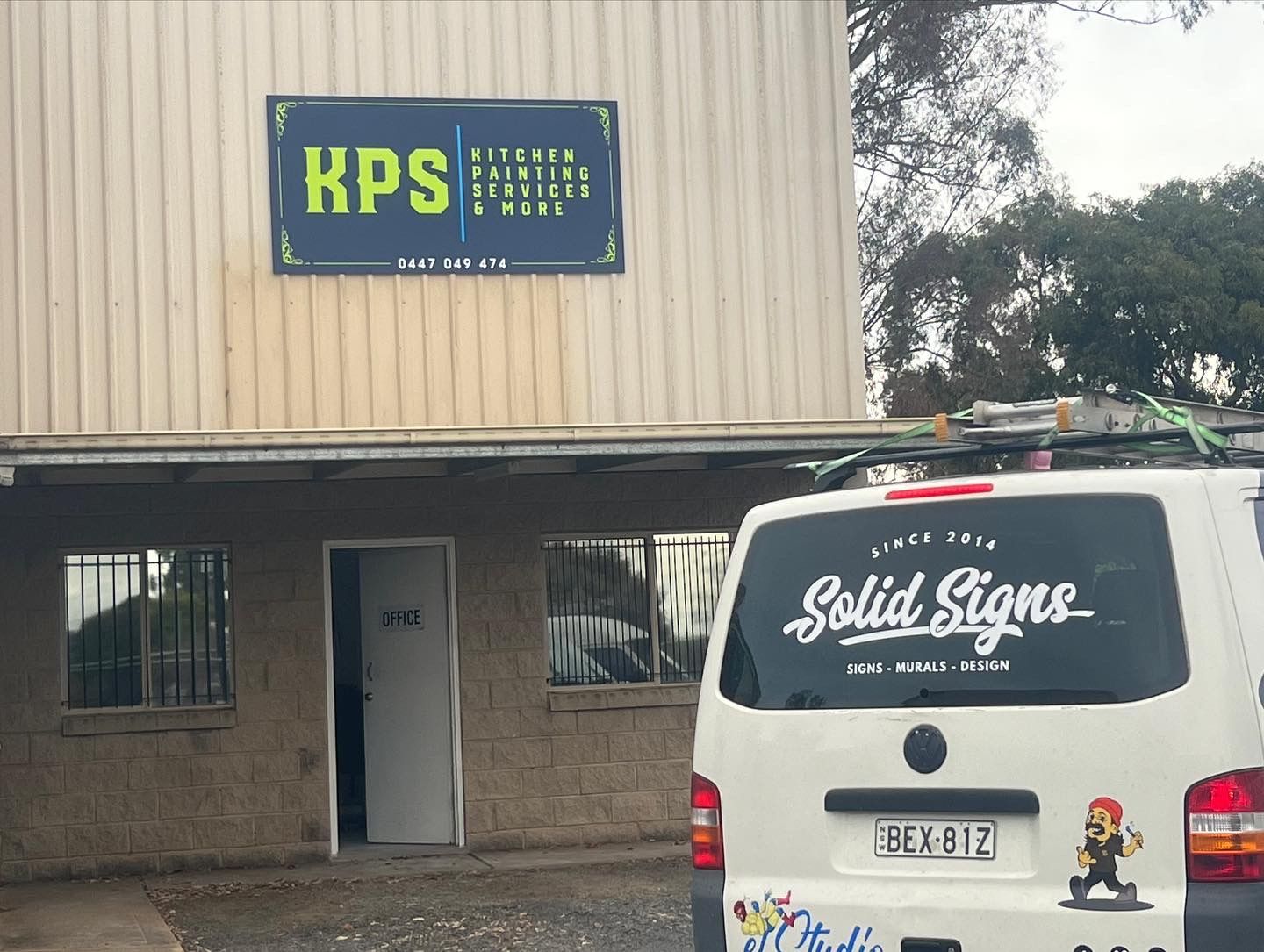 Exterior view of a building with a sign for 