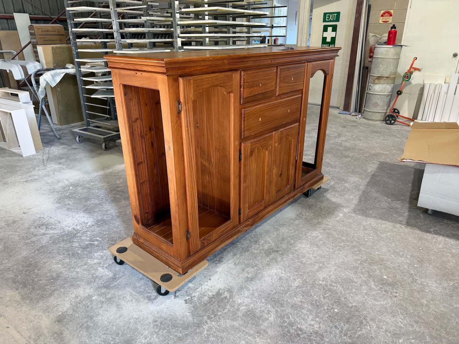 Wooden Cabinet on a Rolling Platform in a Workshop — Kitchen Painting Services & More In Dubbo, NSW