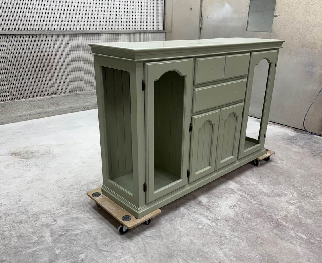 A Green Cabinet on Wheels in a Workshop, Awaiting Painting — Kitchen Painting Services & More In Dubbo, NSW