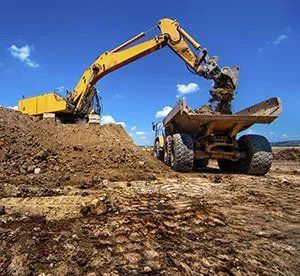 Excavator Loading Soil to Truck