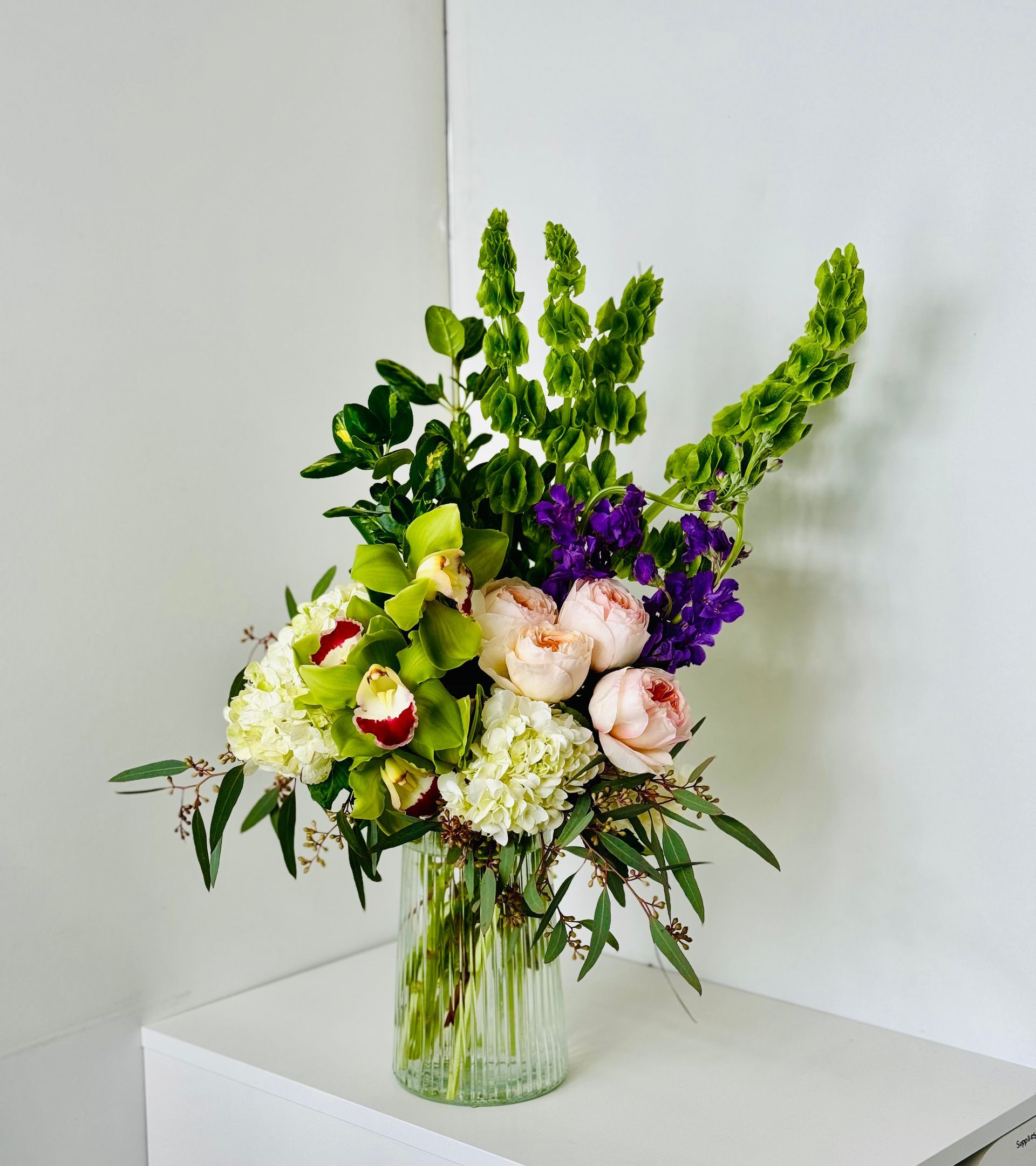 A vase filled with flowers is sitting on a table