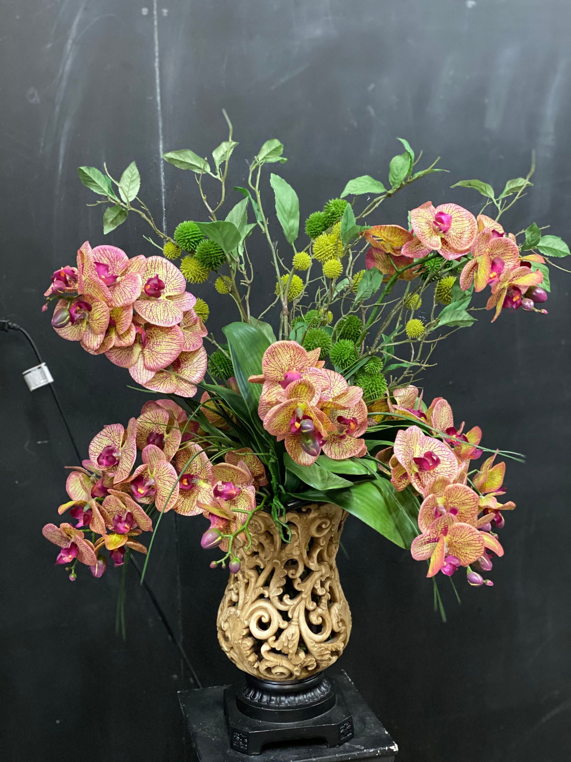 A vase filled with flowers is sitting on a table.