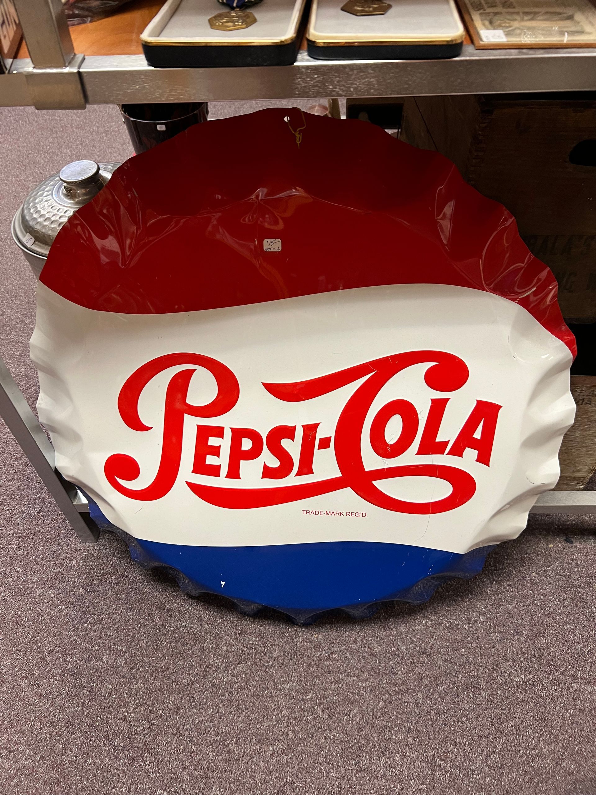 A pepsi cola sign