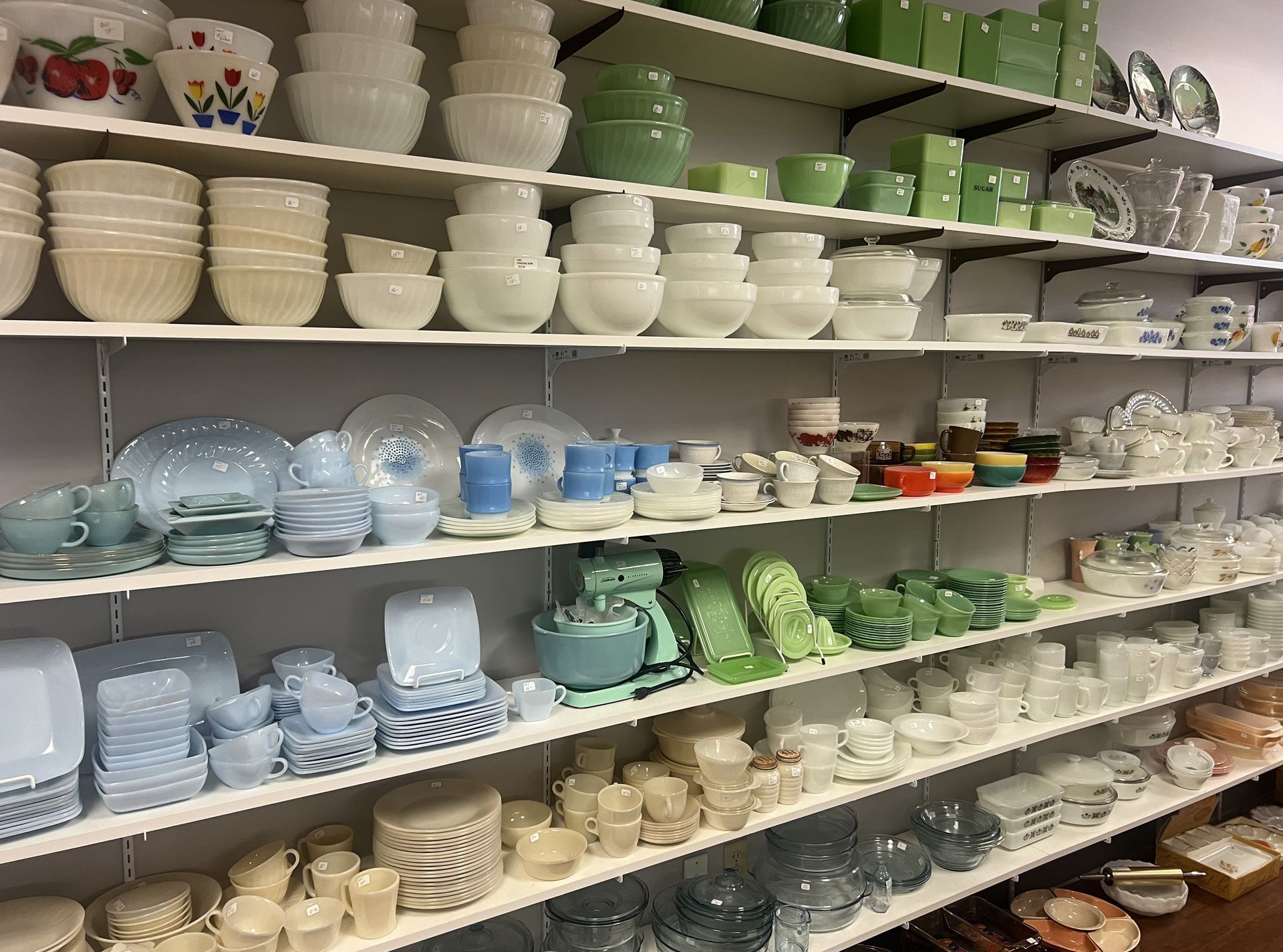 Shelves filled with bowls and plates in a store