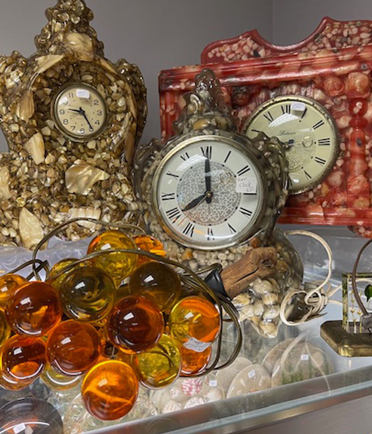 Several clocks are on display including one that shows the time as 4:20