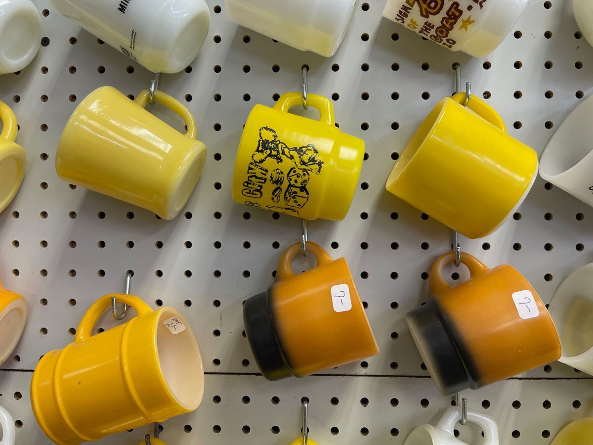 Several yellow coffee mugs