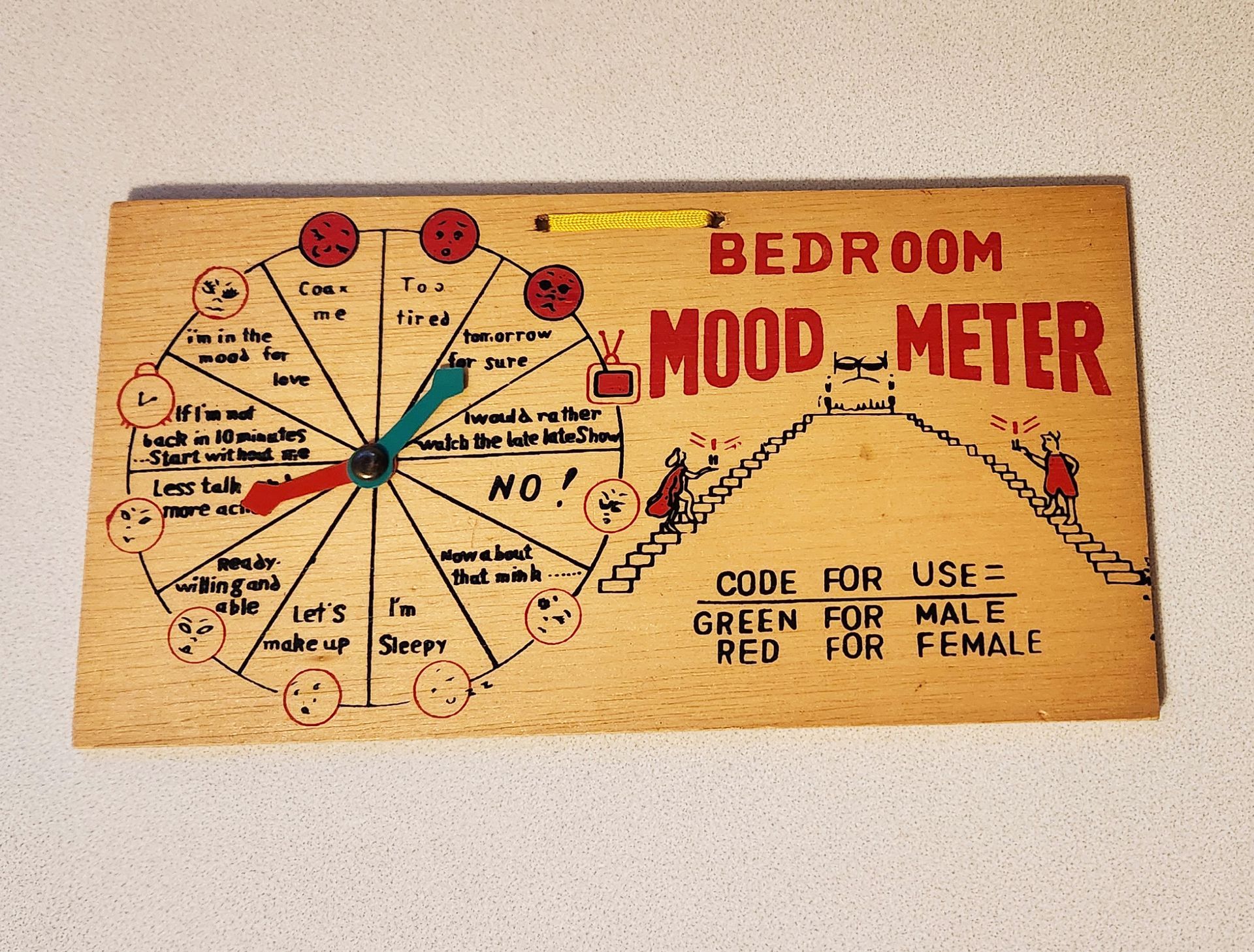 A wooden sign that says bedroom mood meter on it