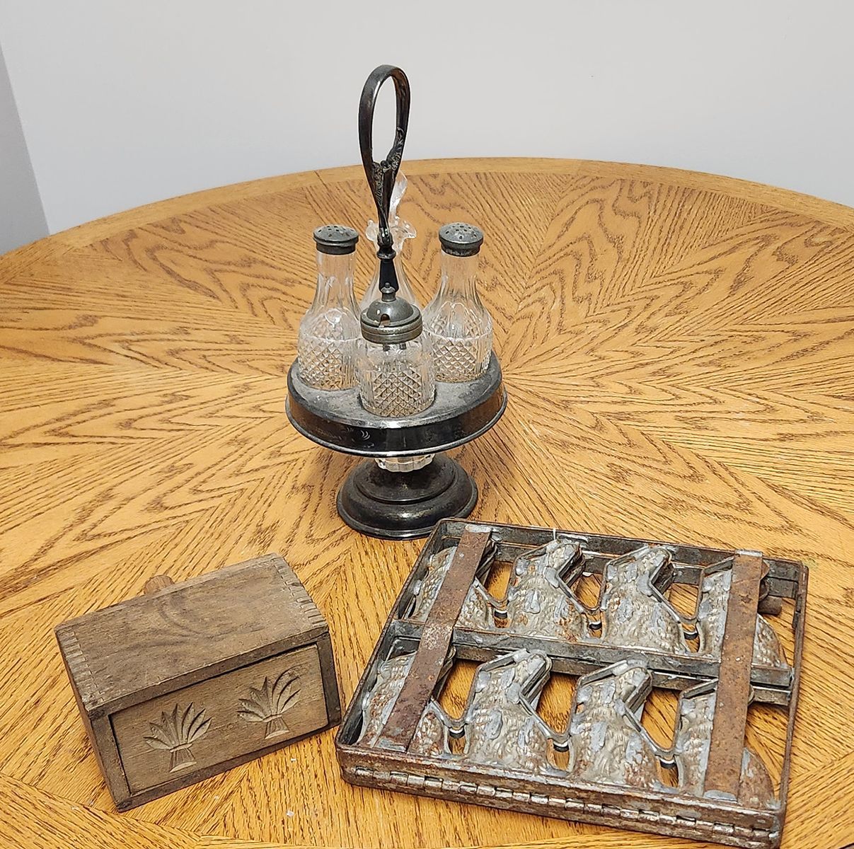 A wooden table with a glass container on top of it