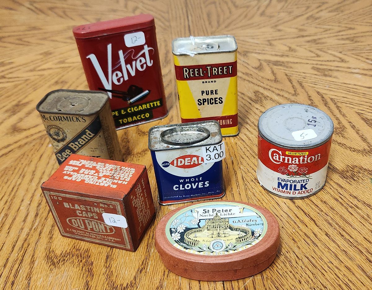 A can of velvet sits on a table with other cans