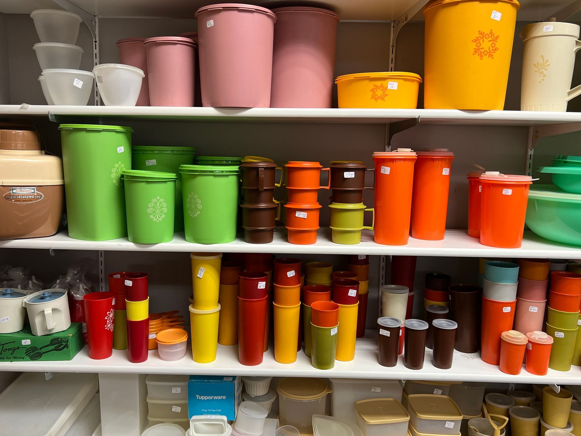 A shelf full of colorful plastic containers 