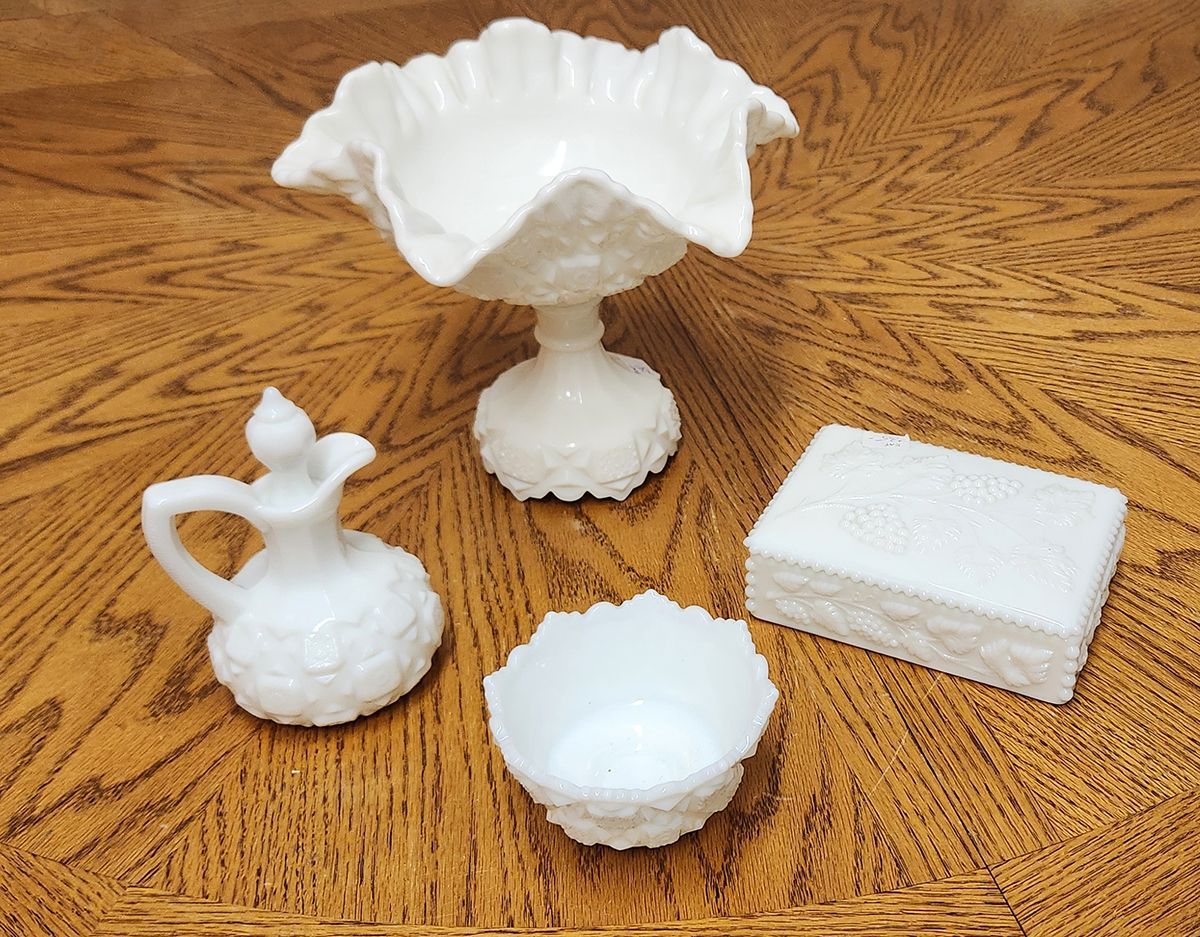 A wooden table with a few white objects on it