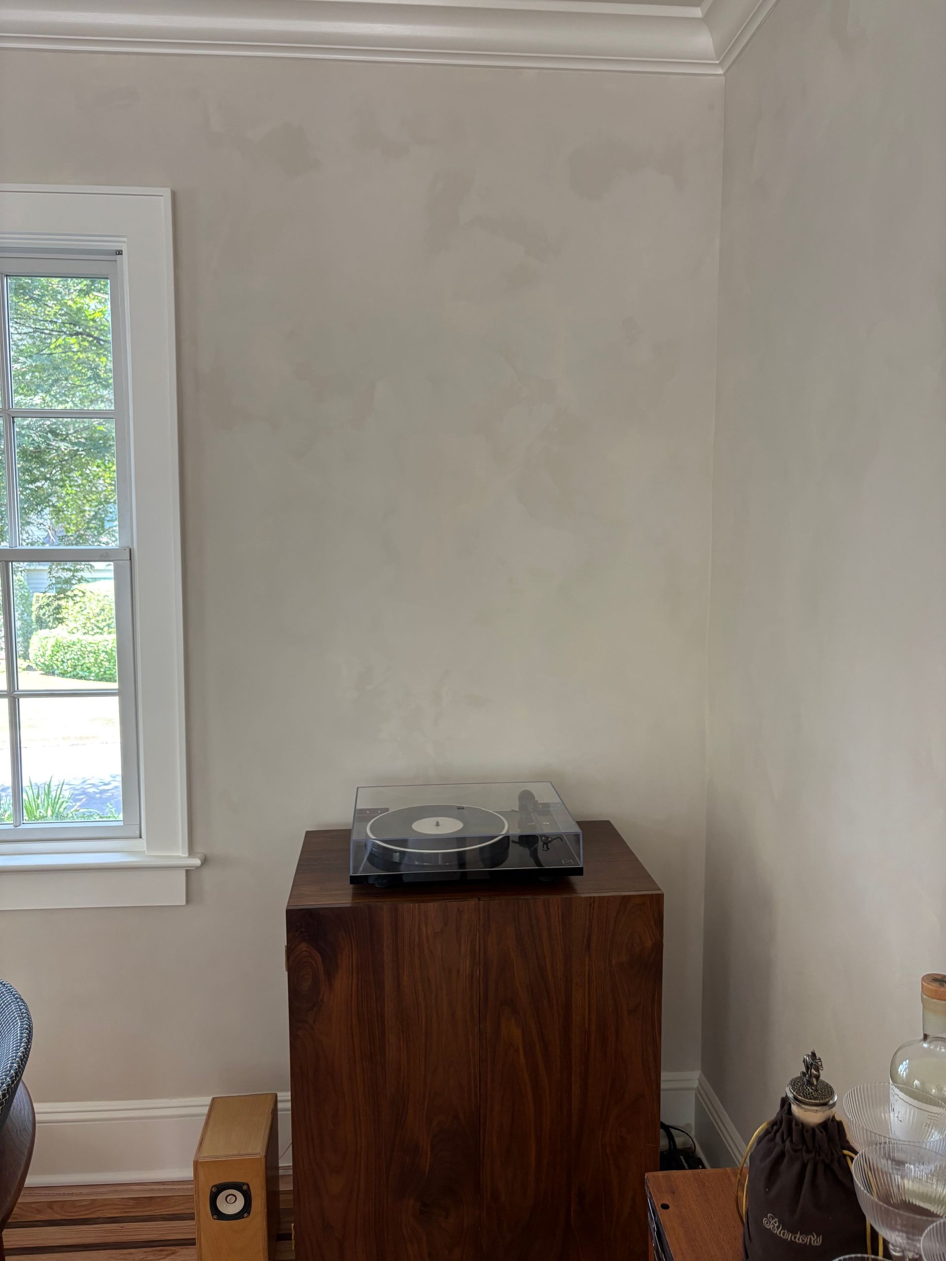 Turntable mural with vinyl record, speaker, and window view.