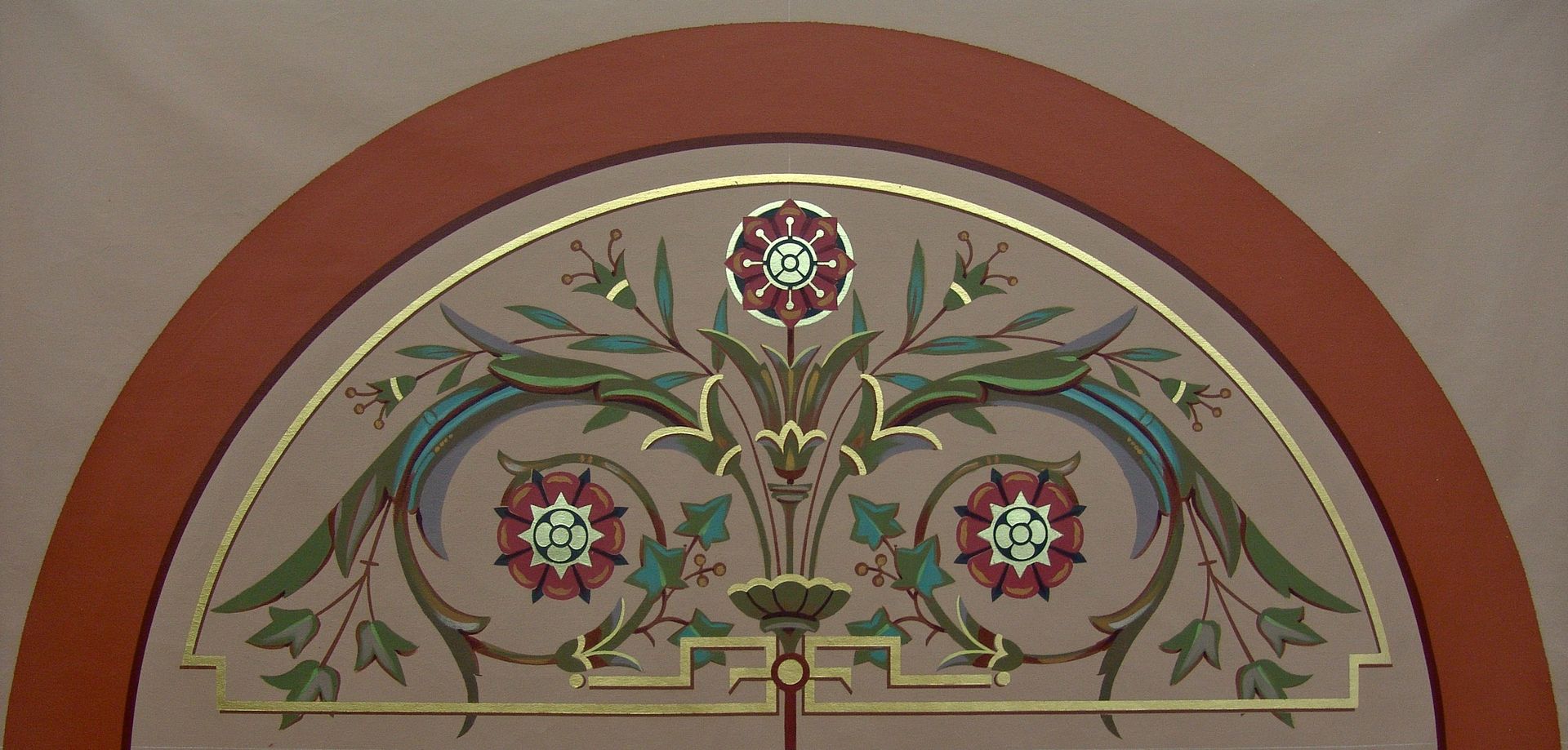 Mural with symmetrical floral arch, red petals and green vines.