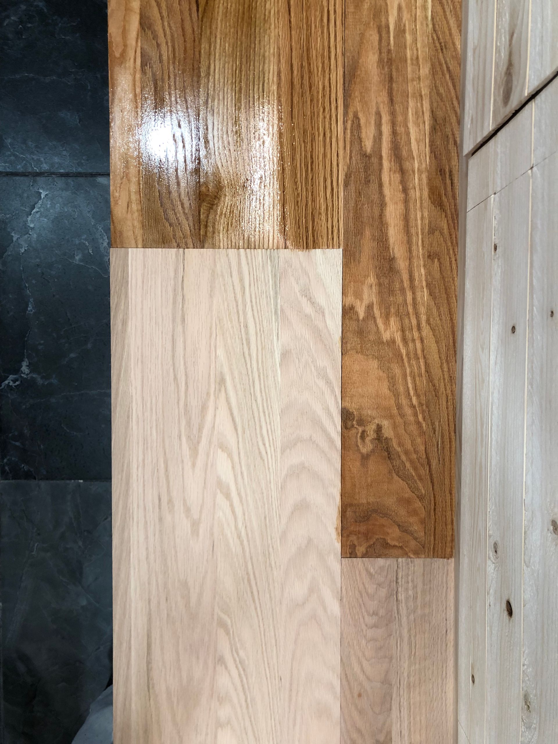 Flooring samples: wood finishes from light pine to dark stain