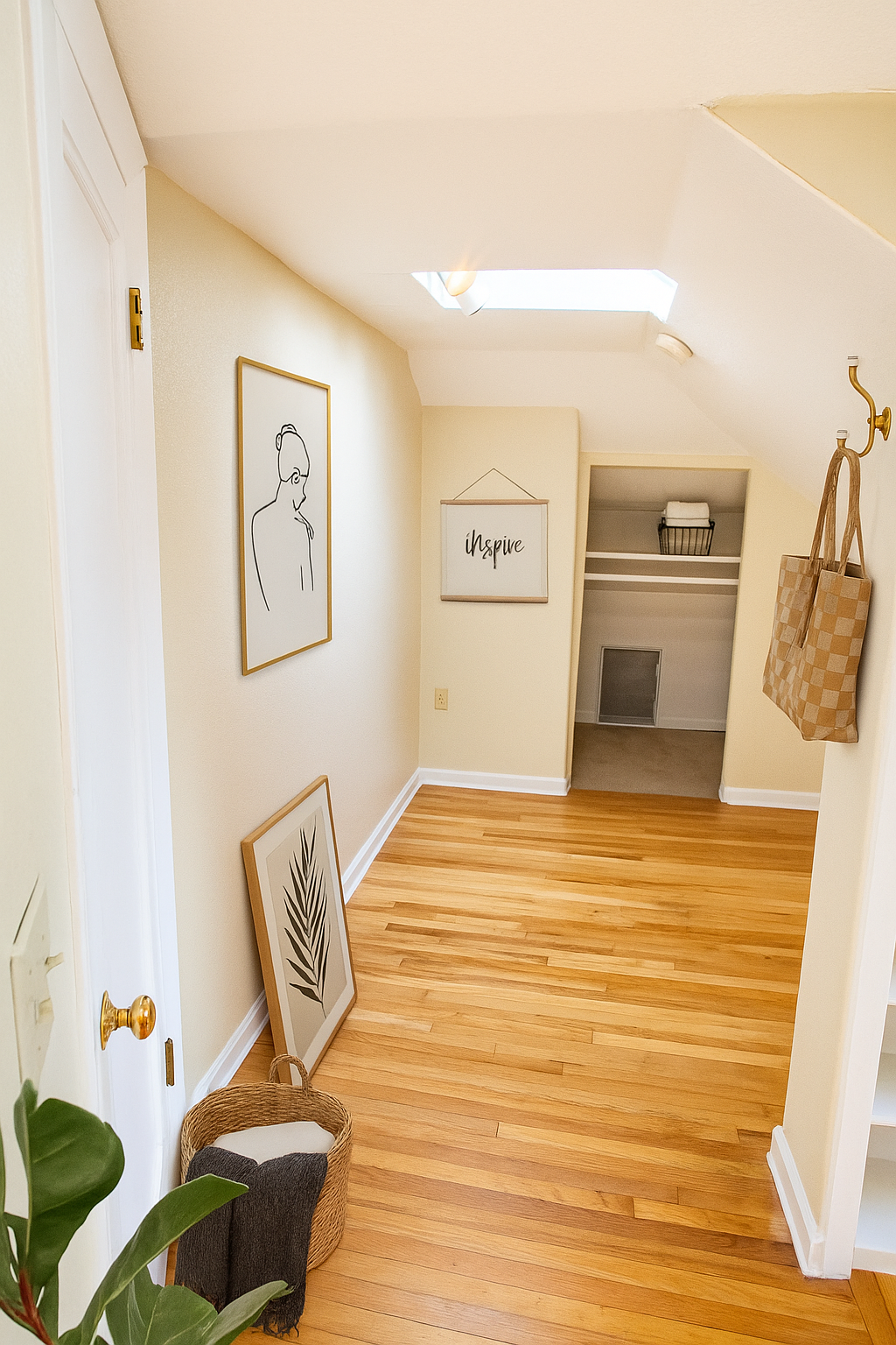 A hallway with hardwood floors leading to a closet.