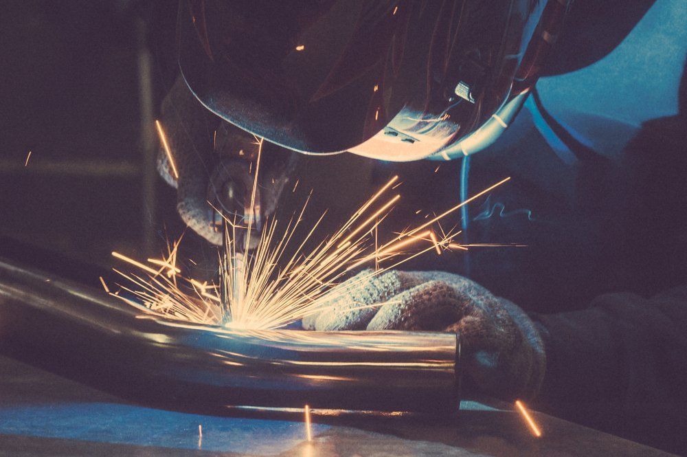 Welder in Protective Gear Welding Metal — Sheetmetal Improvements & Design in Burleigh Heads, QLD