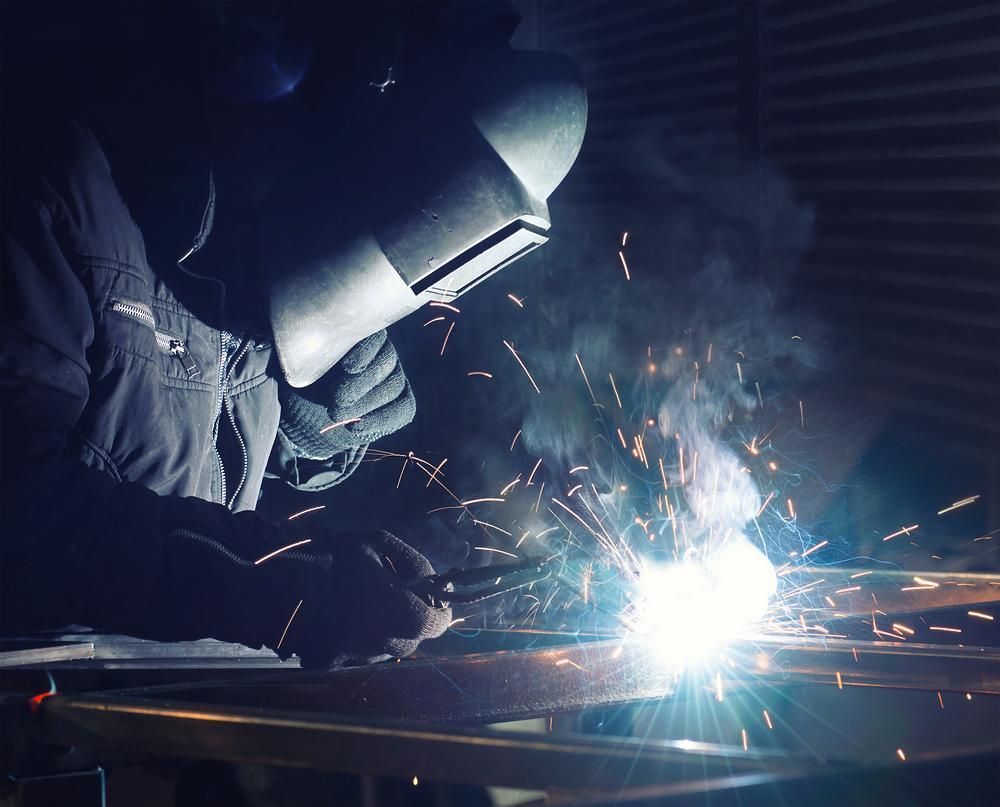 Welder In Protective Mask — Sheetmetal Improvements & Design in Yatala, QLD